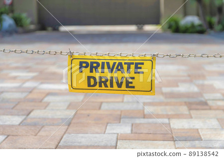 Private drive signage hanging on a chain link at La Jolla, San Diego, California Private drive signage hanging on a chain link at La Jolla, San Diego, California 89138542