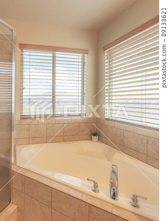 Vertical Corner bathtub and shower stall with ceramic tiles surround 89138621