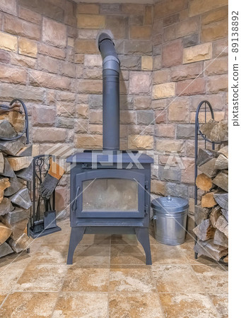Vertical Interior of a fireplace with vintage wood burning stove 89138892