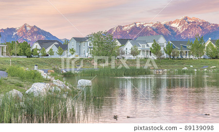 Panorama Oquirrh Lake with a reflection of the pink and orange hue colors of the sky 89139098