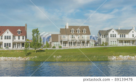 Panorama Whispy white clouds Oquirrh Lake waterfront at Daybreak, Utah residential area 89139476