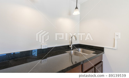 Panorama Kitchen sink with black granite top and dark wood drawers and cabinets Panorama Kitchen sink with black granite top and dark wood drawers and cabinets 89139539