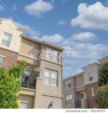 Square White puffy clouds Modern classic low rise buildings at San Marcos, California Square White puffy clouds Modern classic low rise buildings at San Marcos, California 89140507