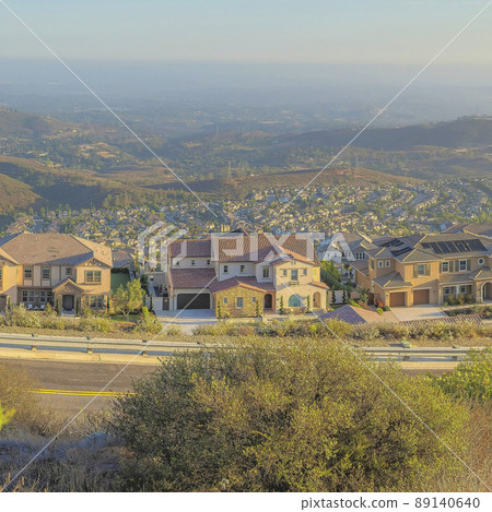 Square Puffy clouds at sunset Panoramic high view of San Marcos community at San Diego, California 89140640