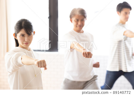 A woman attending a karate class 89140772