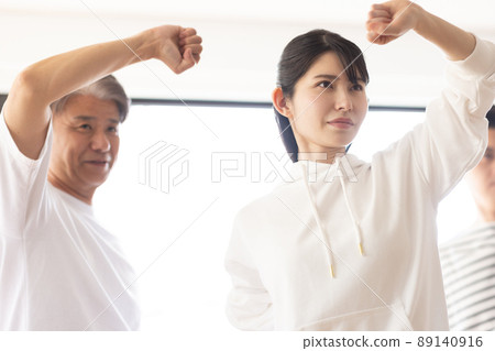 A woman attending a karate class 89140916