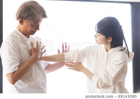 A woman learning self-defense A woman learning self-defense 89141090