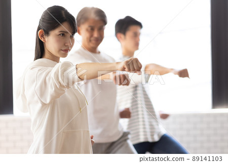 A woman attending a karate class 89141103