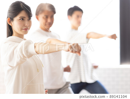 A woman attending a karate class 89141104