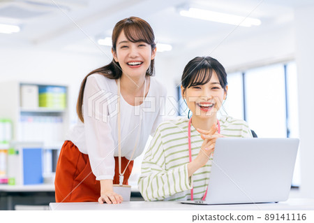 Young female engineer working in an office 89141116