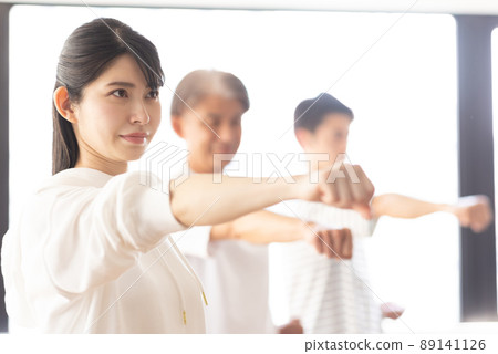 A woman attending a karate class A woman attending a karate class 89141126