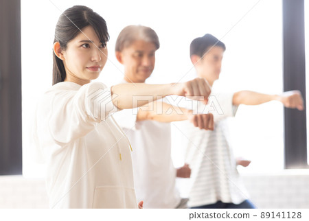 A woman attending a karate class A woman attending a karate class 89141128