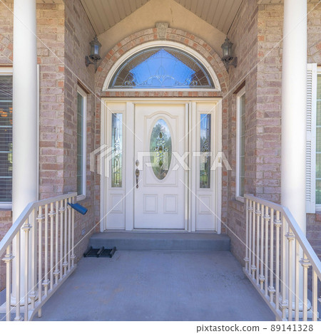 Square Huge single white front door with ornate glass panels and arched transom window 89141328