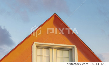 Panorama Puffy clouds at sunset Orange gable roof with attic at Oceanside, California 89141650