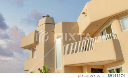 Panorama Puffy clouds at sunset Side view of a mediterranean style building at Oceanside, Califo Panorama Puffy clouds at sunset Side view of a mediterranean style building at Oceanside, Califo 89141674