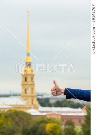 A male hand shows a gesture - it's good, it's cool, thumb up. A male hand shows a gesture - it's good, it's cool, thumb up. 89141767