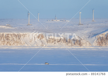 Winter arctic industrial landscape with a wind farm Winter arctic industrial landscape with a wind farm 89141768