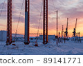 Winter industrial landscape. Morning view of power poles and port cranes. 89141771