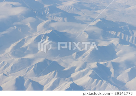 Aerial view of snow-capped mountains 89141773