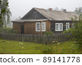 Old wooden house behind a fence 89141778