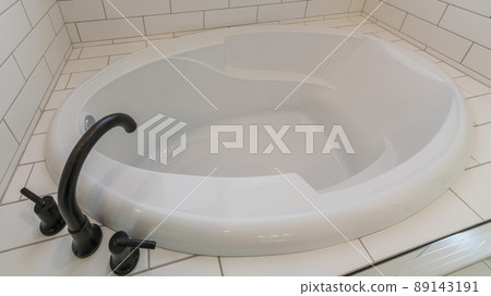 Panorama Alcove bathtub with deck mounted faucet and subway tiles surround Panorama Alcove bathtub with deck mounted faucet and subway tiles surround 89143191