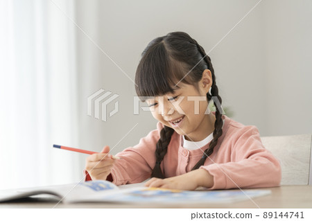 First grade girl studying at home First grade girl studying at home 89144741