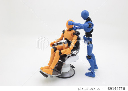a figure having haircut at barber shop 89144756