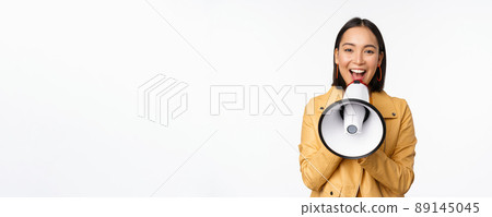 Attention announcement. Image of asian woman shouting in megaphone, recruiting, searching people, sharing information, standing over white background 89145045