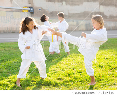 Kids sparring during karate training 89146140