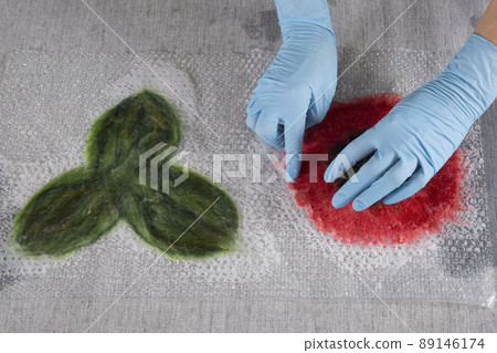 Wet felting wool in the process of creating a product 89146174