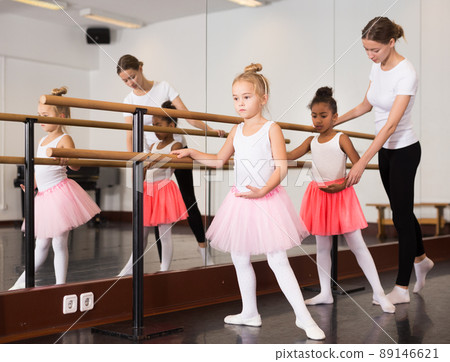 Teacher helping her little ballerinas Teacher helping her little ballerinas 89146621