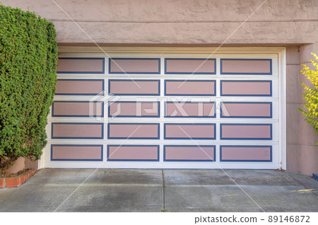 Garage door with white grid trims and pink panels with blue frames at San Francisco, California Garage door with white grid trims and pink panels with blue frames at San Francisco, California 89146872