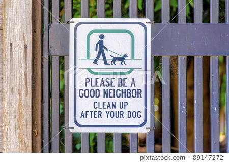 Sign with please be a good neighbor clean up after your dog 89147272