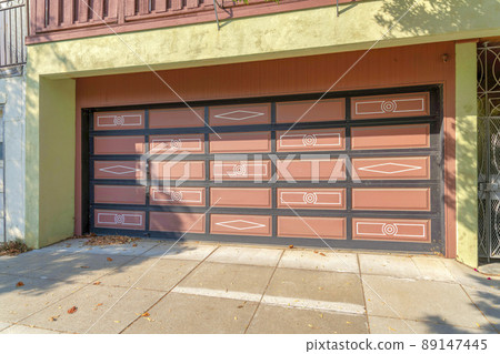 Garage exterior with peach exterior and black grids at San Francisco, California 89147445