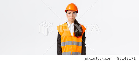 Serious-looking professional female asian construction engineer, architect at building area wearing uniform, safety helmet over business suit, standing white background, inspect enterprise Serious-looking professional female asian construction engineer, architect at building area wearing uniform, safety helmet over business suit, standing white background, inspect enterprise 89148171