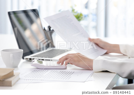 Business woman analyzing data graph in private office room, Presents Graph data and plan marketing strategies for executives who attend team meetings to analyze and develop for business. 89148441