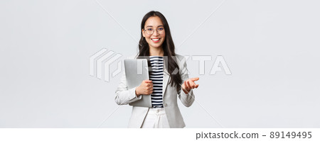 Business, finance and employment, female successful entrepreneurs concept. Smiling professional businesswoman, real estate broker showing clients good deal, carry laptop in hand Business, finance and employment, female successful entrepreneurs concept. Smiling professional businesswoman, real estate broker showing clients good deal, carry laptop in hand 89149495