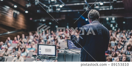 Public speaker giving talk at Business Event. 89153810