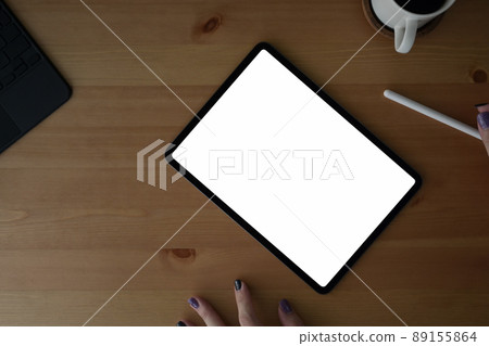 Mock up digital tablet with white screen and stylus pen at creative workplace. Mock up digital tablet with white screen and stylus pen at creative workplace. 89155864