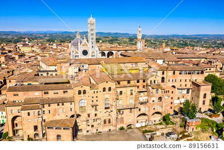Aerial view of Siena with the Cathedral and the Mangia Tower. UNESCO world heritage in Tuscany, Italy Aerial view of Siena with the Cathedral and the Mangia Tower. UNESCO world heritage in Tuscany, Italy 89156631