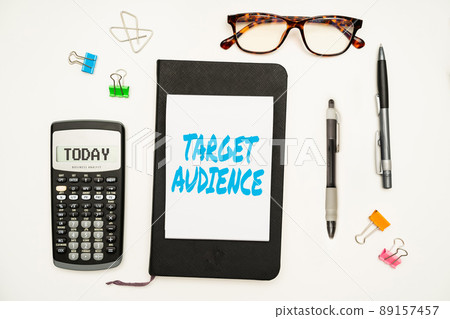 Text showing inspiration Target Audience. Business approach category of showing you want to address your words to Office Supplies Over Desk With Keyboard And Glasses And Coffee Cup For Working Text showing inspiration Target Audience. Business approach category of showing you want to address your words to Office Supplies Over Desk With Keyboard And Glasses And Coffee Cup For Working 89157457
