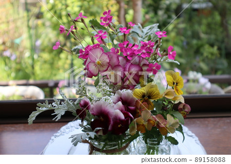 Decorate the flowers in the garden on the bay window Decorate the flowers in the garden on the bay window 89158088