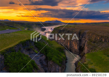 Aerial view of sunset over Gullfoss waterfall and the Olfusa river in Iceland Aerial view of sunset over Gullfoss waterfall and the Olfusa river in Iceland 89158139