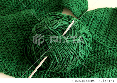 green cotton yarn ball and crochet needle green cotton yarn ball and crochet needle 89158473