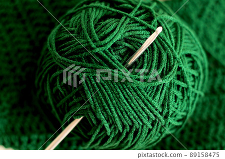 green cotton yarn ball and crochet needle green cotton yarn ball and crochet needle 89158475