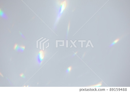 Blurred rainbow light refraction texture on white wall 89159488