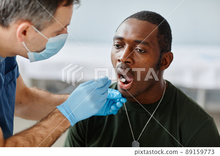 Taking Mouth Swab From Soldier 89159773