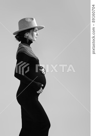 beautiful pregnant woman in dress holding her belly beautiful pregnant woman in dress holding her belly 89160704