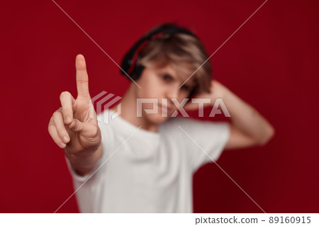 man with headphones pressing button on virtual screens man with headphones pressing button on virtual screens 89160915