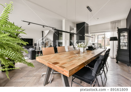The interior of the dining area with modern furniture and design in a cozy house 89161809